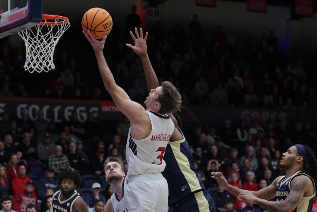 Men's Basketball player Augustas Marciulionis shoots against Akron on November 12, 2024