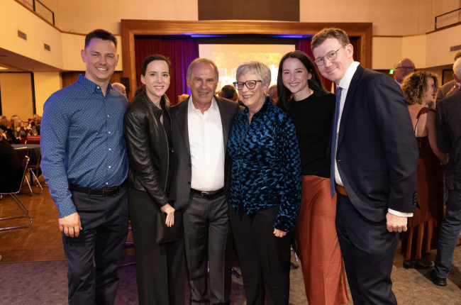 Honoree Paul Stich and wife Linda gather with their children at the 2024 Pat Vincent Fundraising Dinner. From left: Andrew Bellay, Kaitlin Stich Bellay, Paul Stich, Linda Stich, Jenna Stich Furlong, and Michael Furlong. / Photo by Ashleen Rai ’25