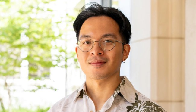 Jian Bumatay posing in a hallway