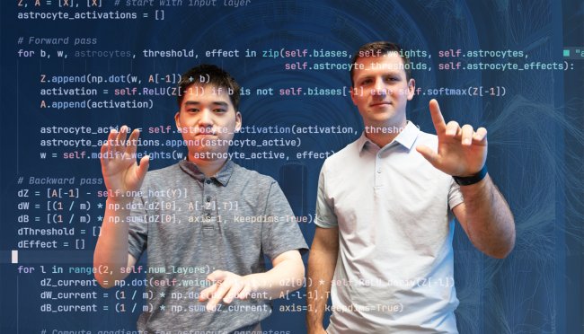 Nathaniel Isaeff and Connor Li with code scrolling in front of them