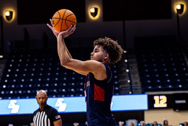 Men's Basketball player Jordan Ross shoots against San Diego in January 2025