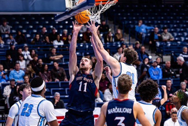 Men's Basketball player Mitchell Saxen shoots against San Diego in January 2025
