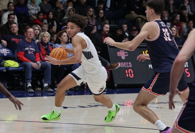 Men's Basketball player Jordan Ross drives against Pepperdine in January 2025