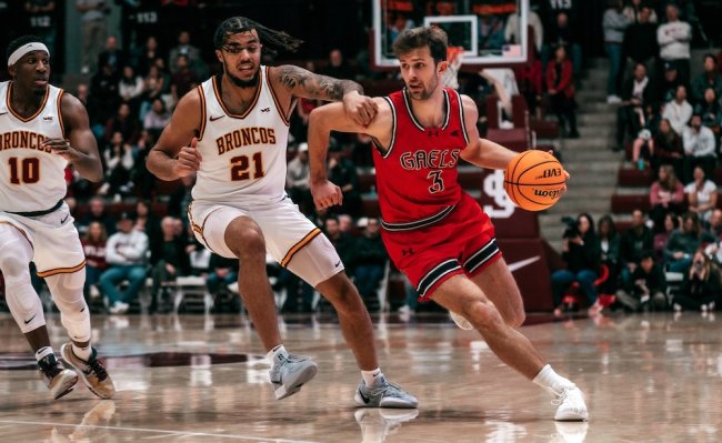 Men's basketball player Augustas Marciulionis drives against Santa Clara in January 2025