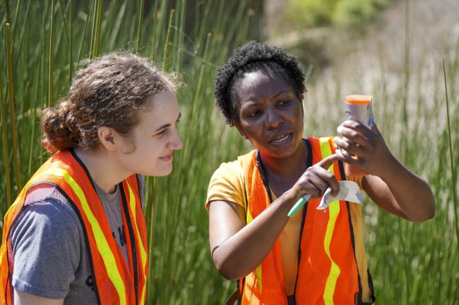 Prof. Nakesha Williams works with a student at the Lafayette Reservoir as part of a Summer Research Project