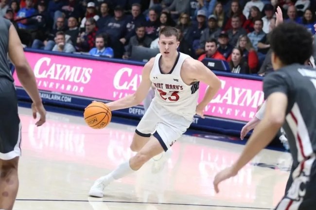 Men's Basketball player Paulius Murauskas drives against Washington State on Lithuania Night 2025