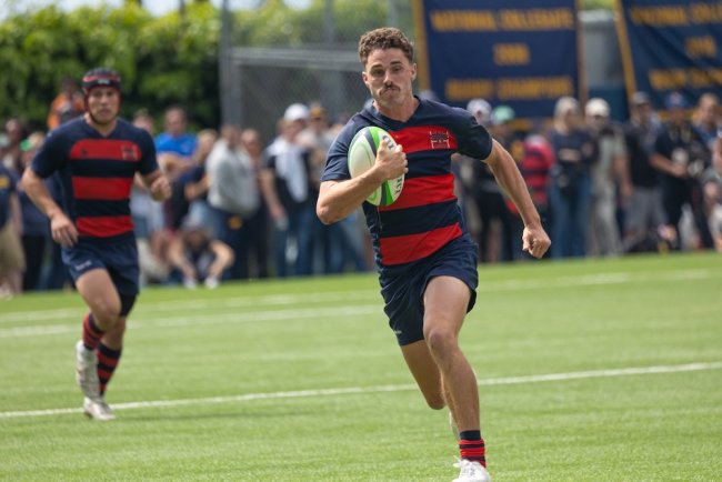 rugby player Mario Storti runs with the ball against Cal in the semifinals in April 2025