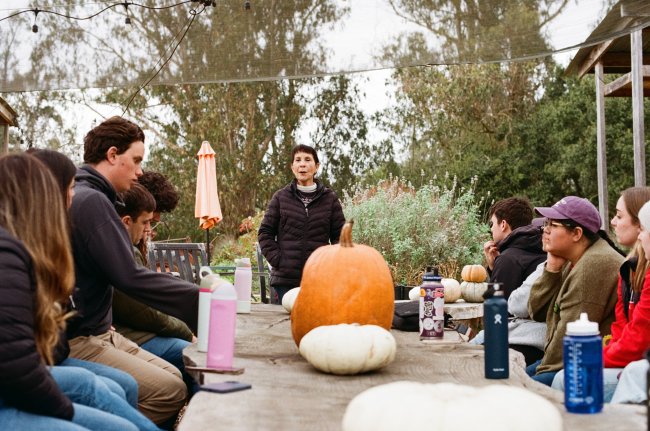 Dr. Ann Lopez speaking with students about NAFTA