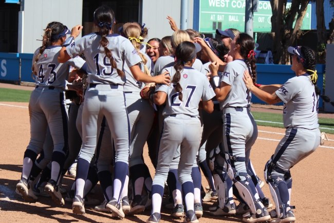 SMC Softball Team cheers in a huddle after winning WCC Title in May 2025