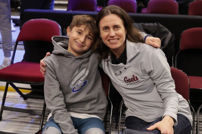 Mary Vollmer and son at Men's Basketball NCAA Tournament vs. Alabama in March 2025