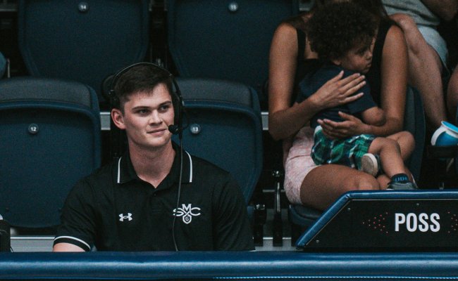 Student working at an athletic game