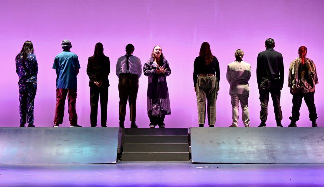 actors from THE LATE WEDDING end scene standing with their backs to the audience