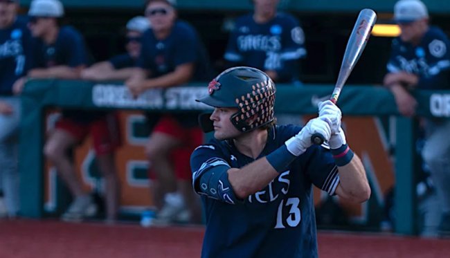 Baseball batter with bat at bat