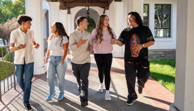 Students walking down hallway together