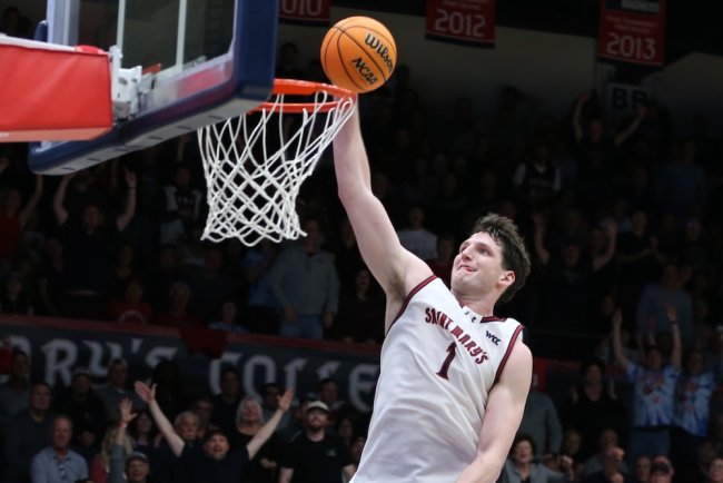 Basketball player Harry Wessels dunks against Santa Clara in February 2026