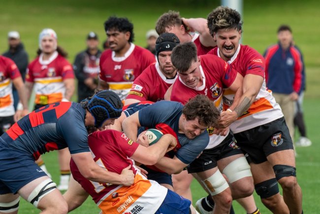 Gaels Rugby player with ball being tackled by a team in New Zealand in January 2026
