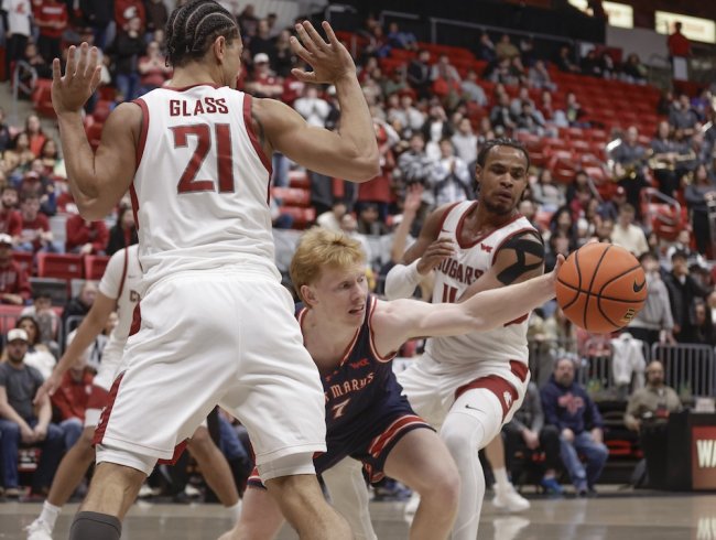 Basketball player Joshua Dent drives against WSU in February 2026