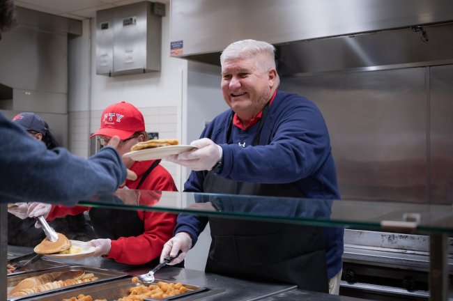 SMC President Roger Thompson serving at Late Night Breakfast