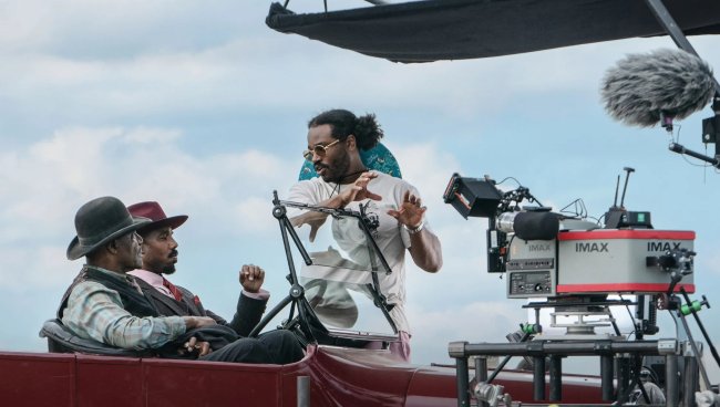 Ryan Coogler directing a scene from Sinners with Michael B. Jordan and Delroy Lindo