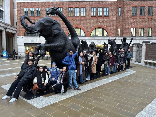 Students by a statue