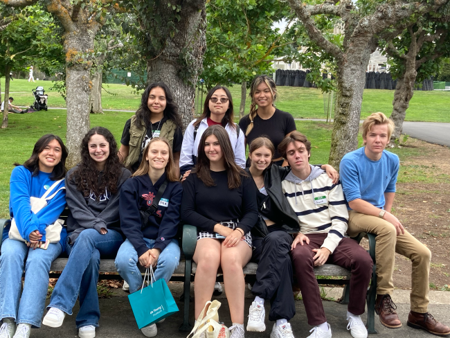 Students on a bench in a park