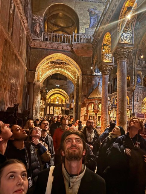 Students looking up in a cathedral