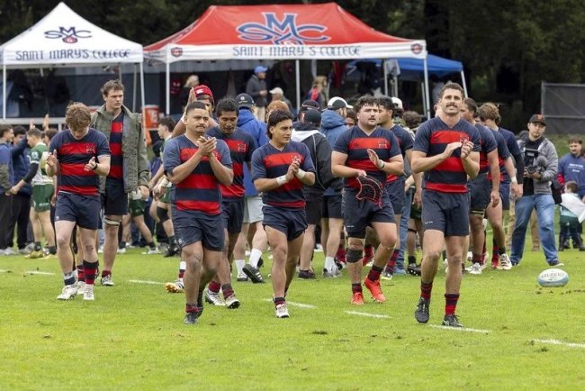 Rugby players celebrate after match on April 11
