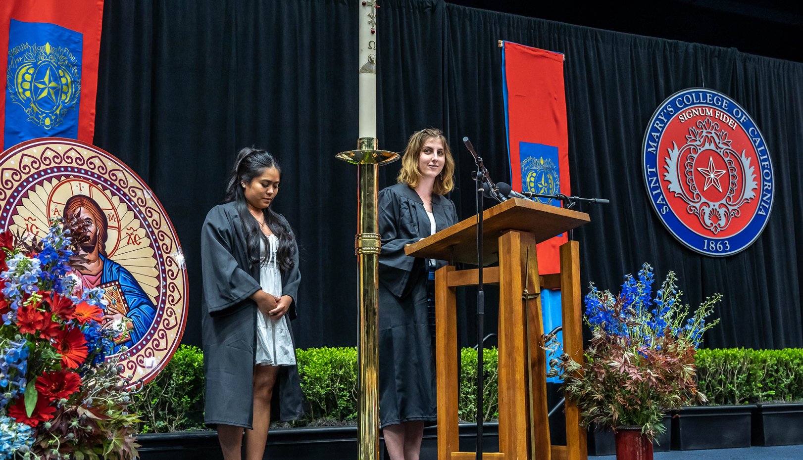 Students speaking near the end of commencement liturgy