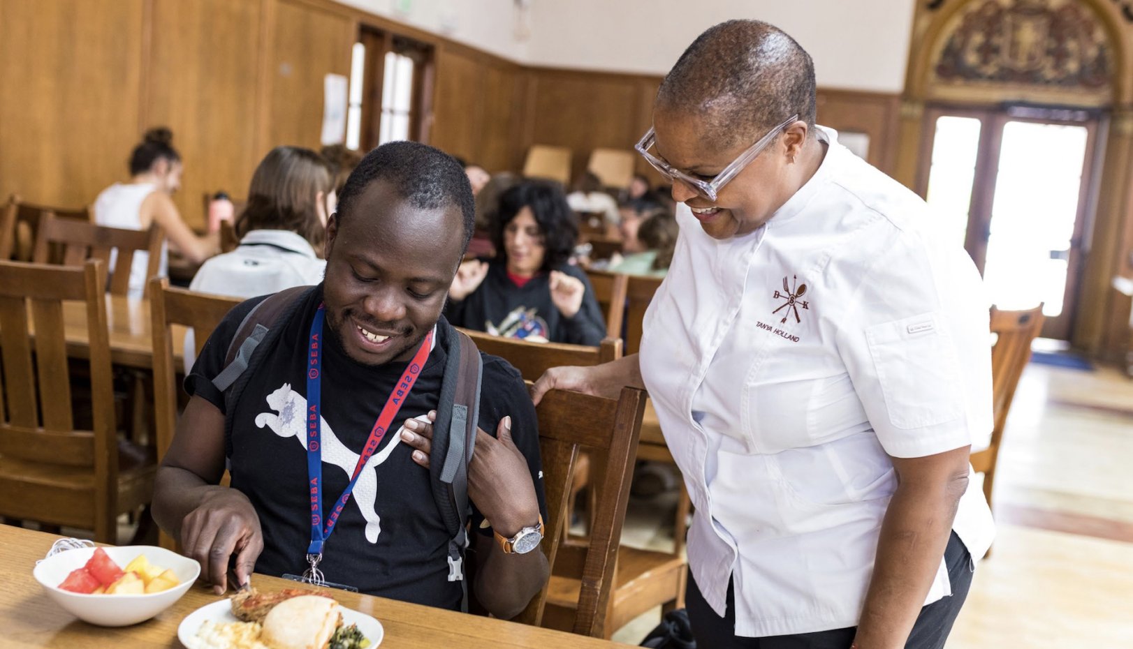 Chef Tanya Holland with SEBA grad student Brian Muganda in Oliver Hall in September 2022