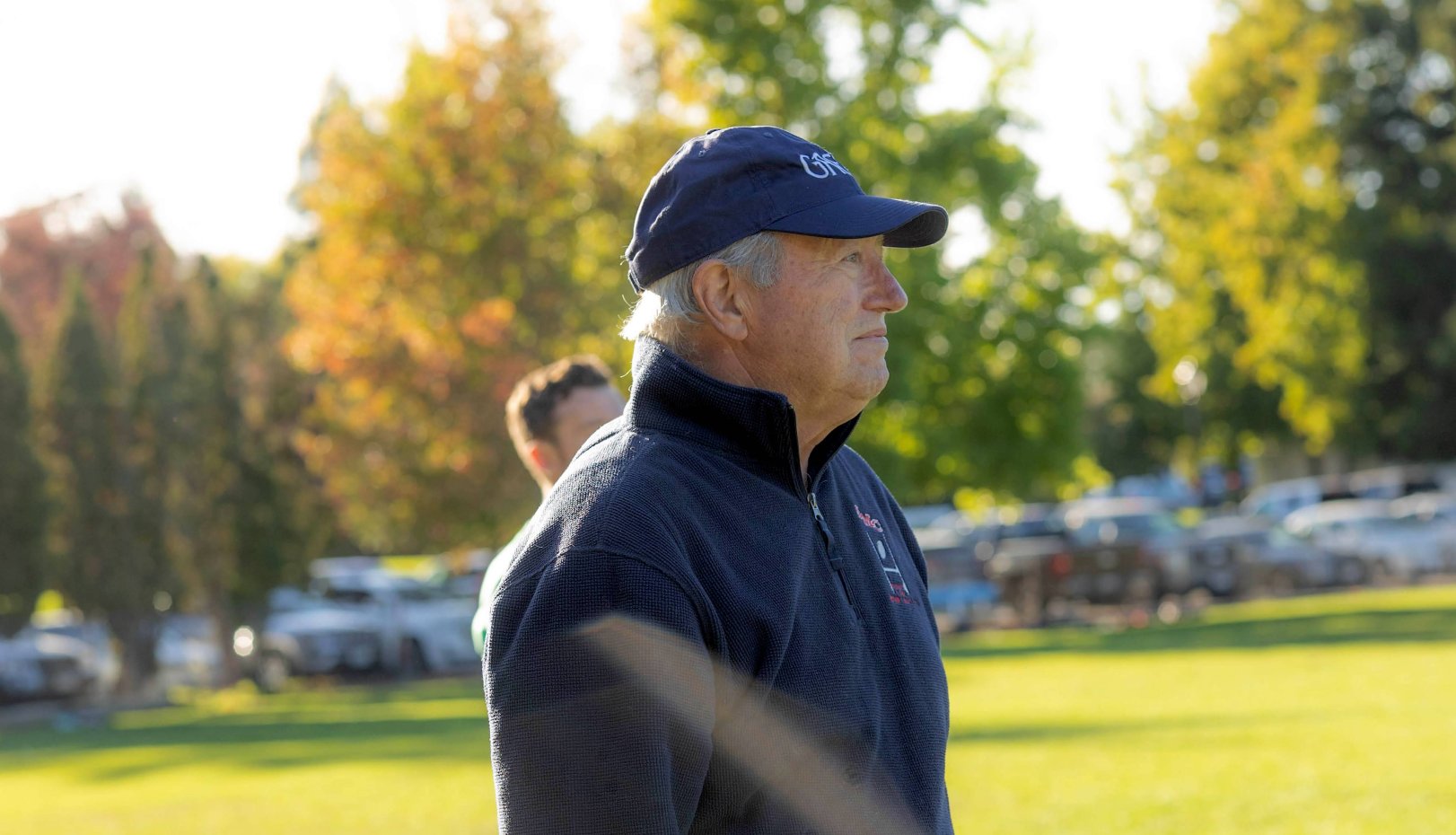 Tom Oneto '65 in profile on a field - honoree for 2023 Pat Vincent Men's Rugby Dinner