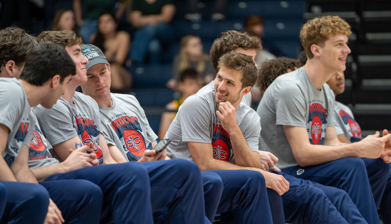 Men's basketball players waiting during 2024 NCAA Selection Sunday