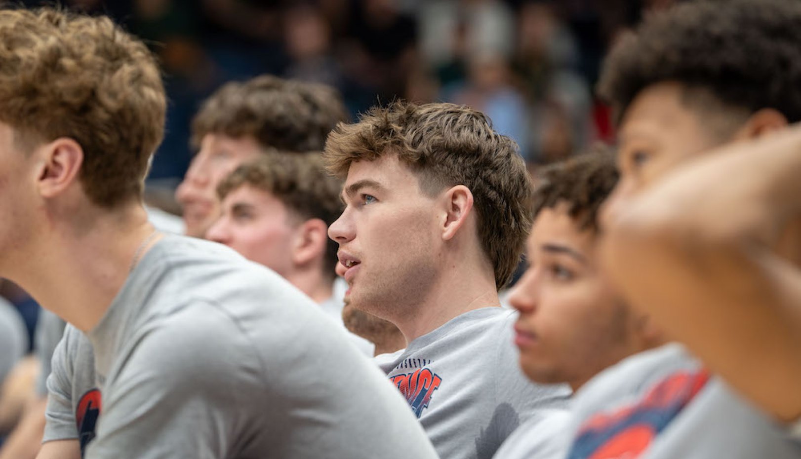 Men's basketball players in profile during NCAA Selection Sunday 2024
