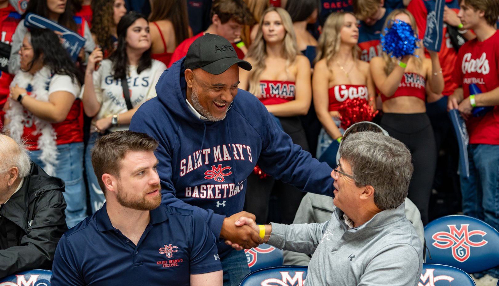 Men shaking hands at men's basketball game vs. Gonzaga 2024