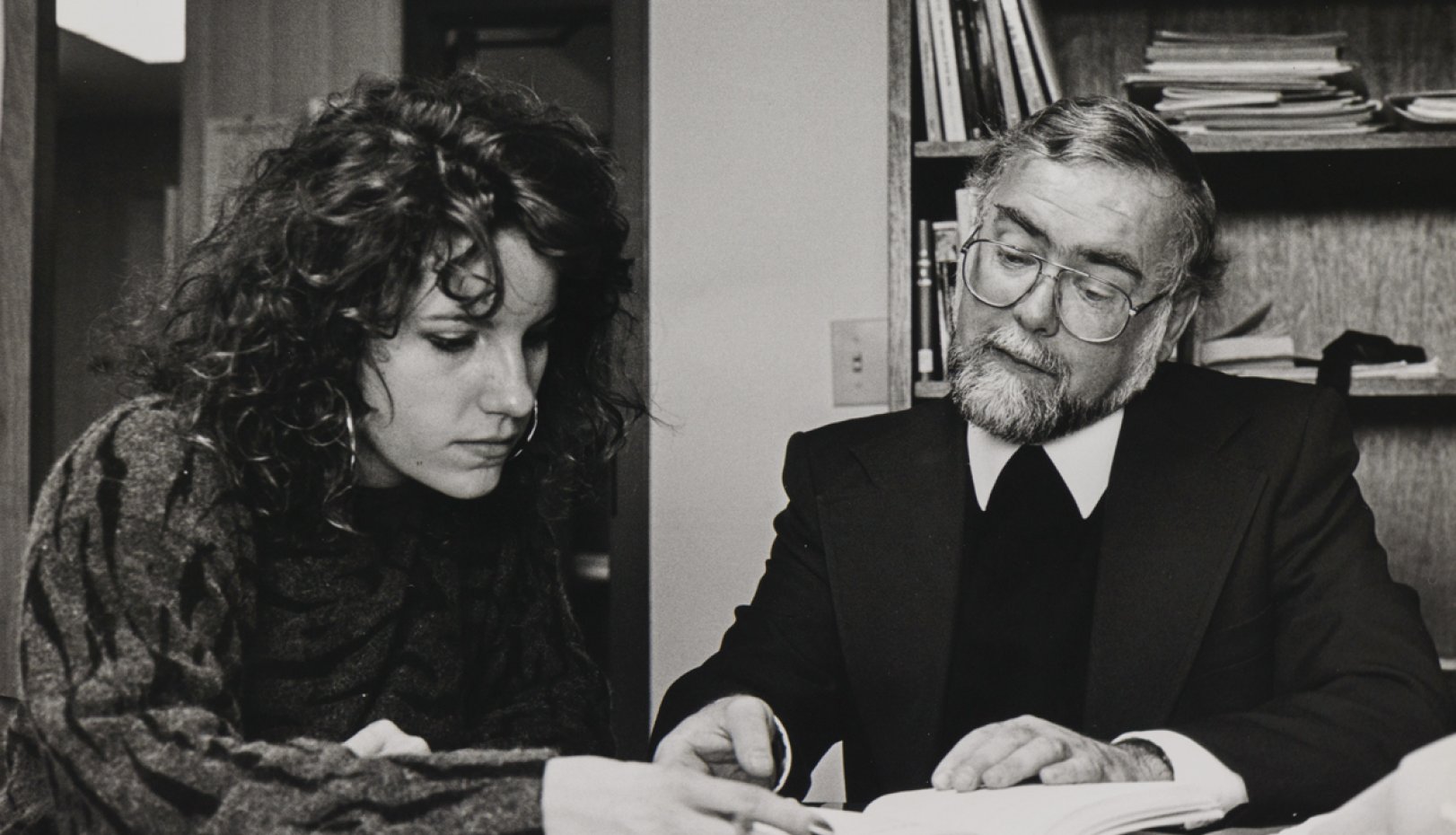 Br Ron helping a student