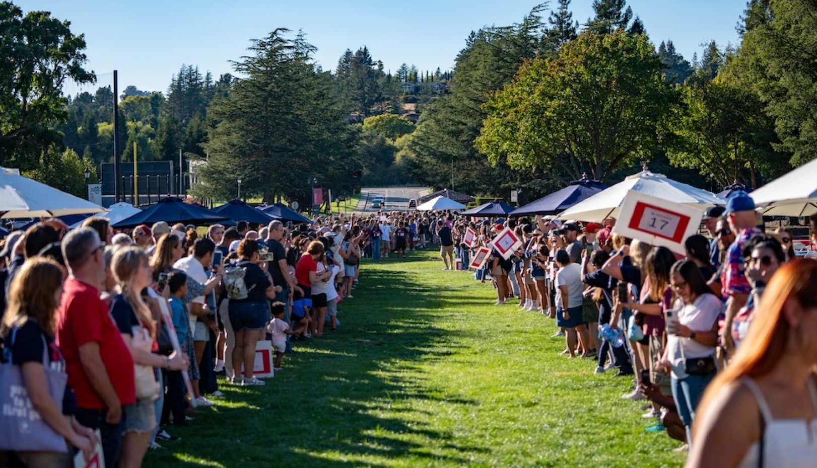 students welcoming new students on lawn