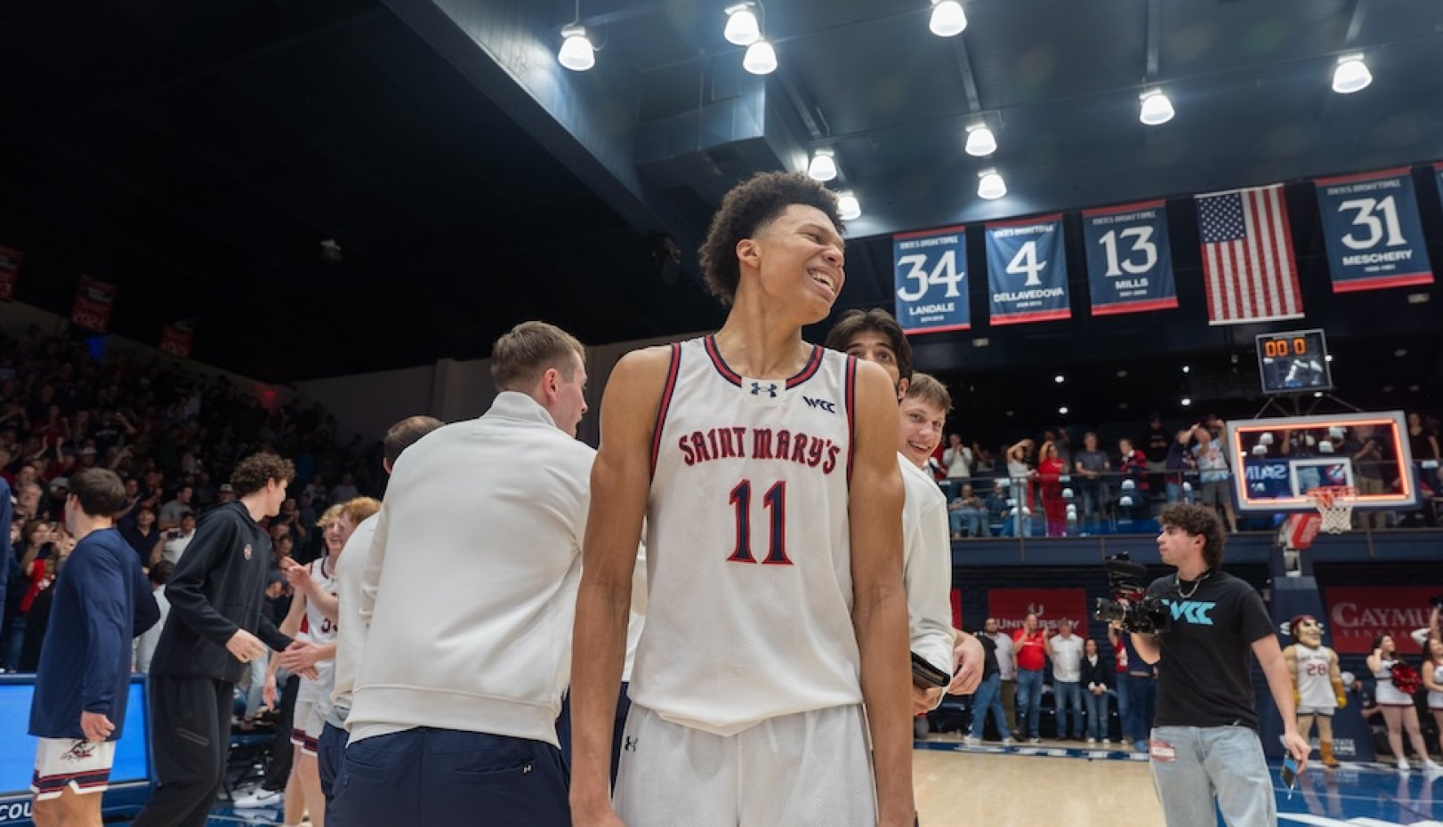 Men's Basketball players celebrate winning WCC Championship in February 2026