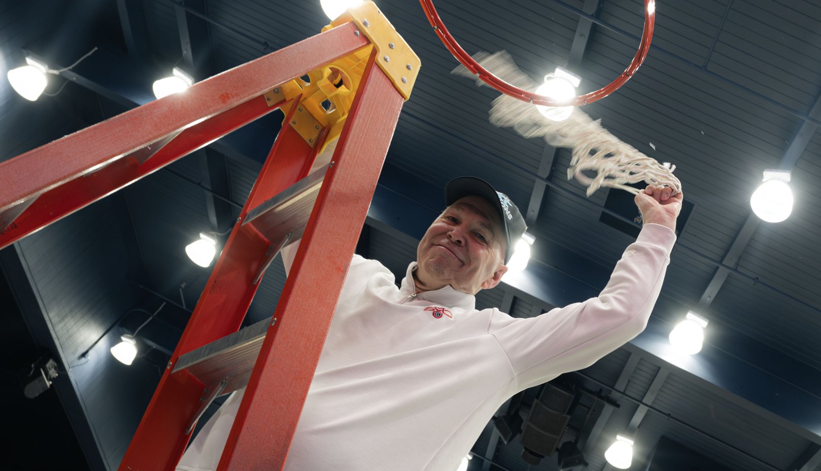 Randy cuts down nets