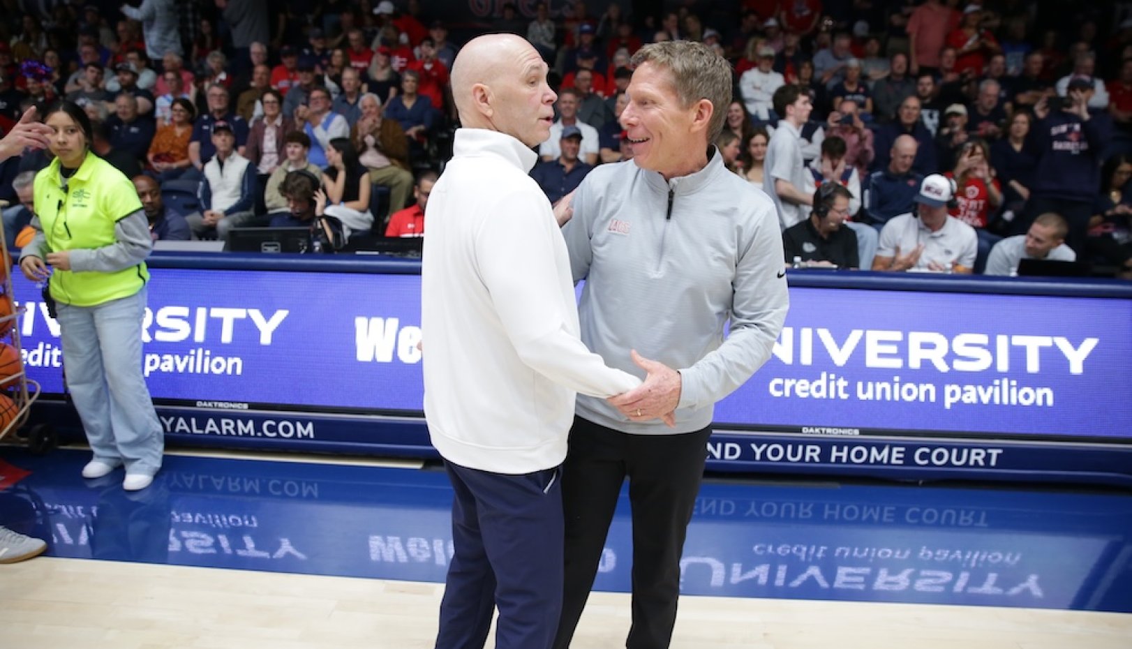 Men's Basketball players celebrate winning WCC Championship in February 2026