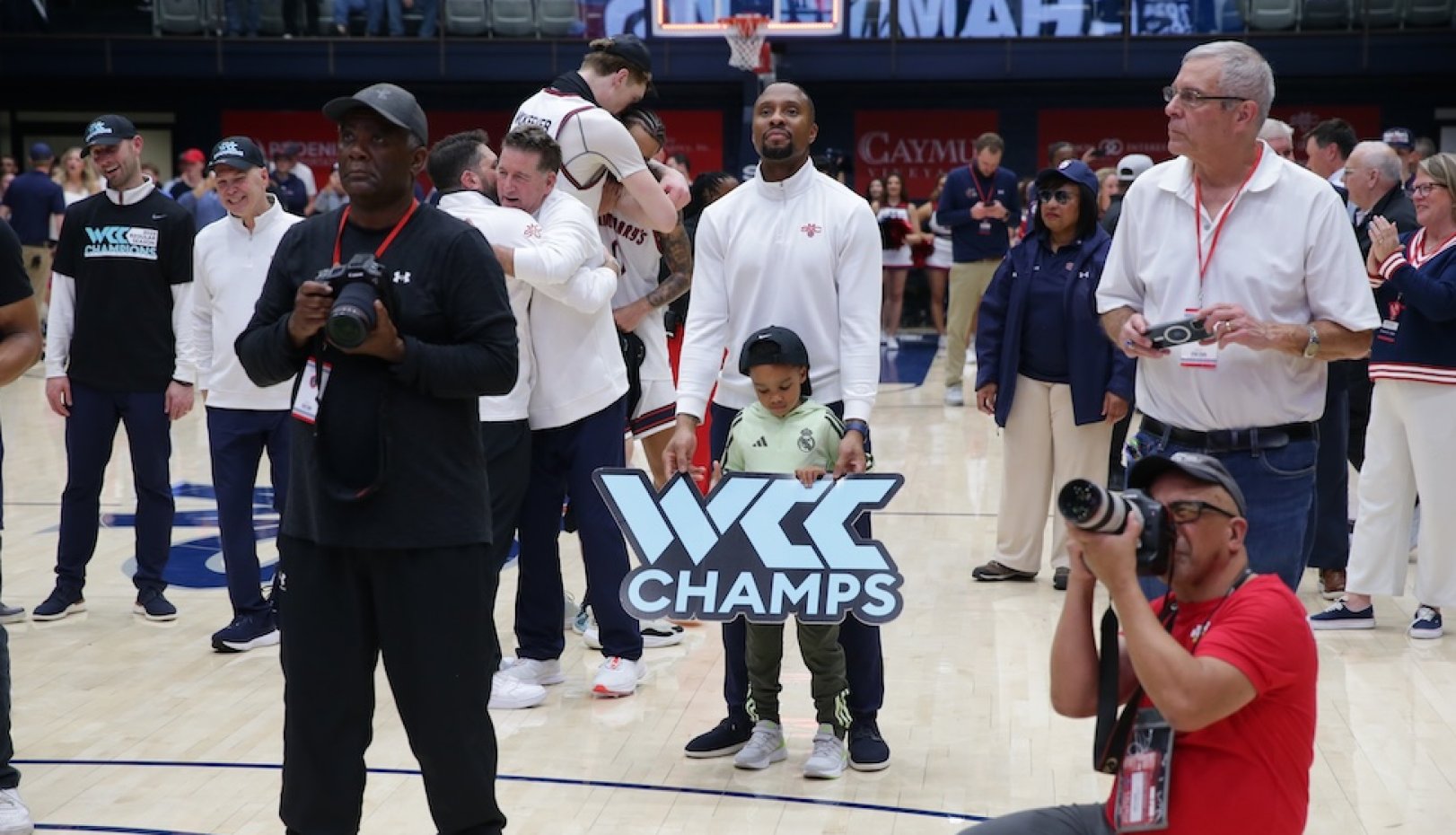 Men's Basketball players celebrate winning WCC Championship in February 2026