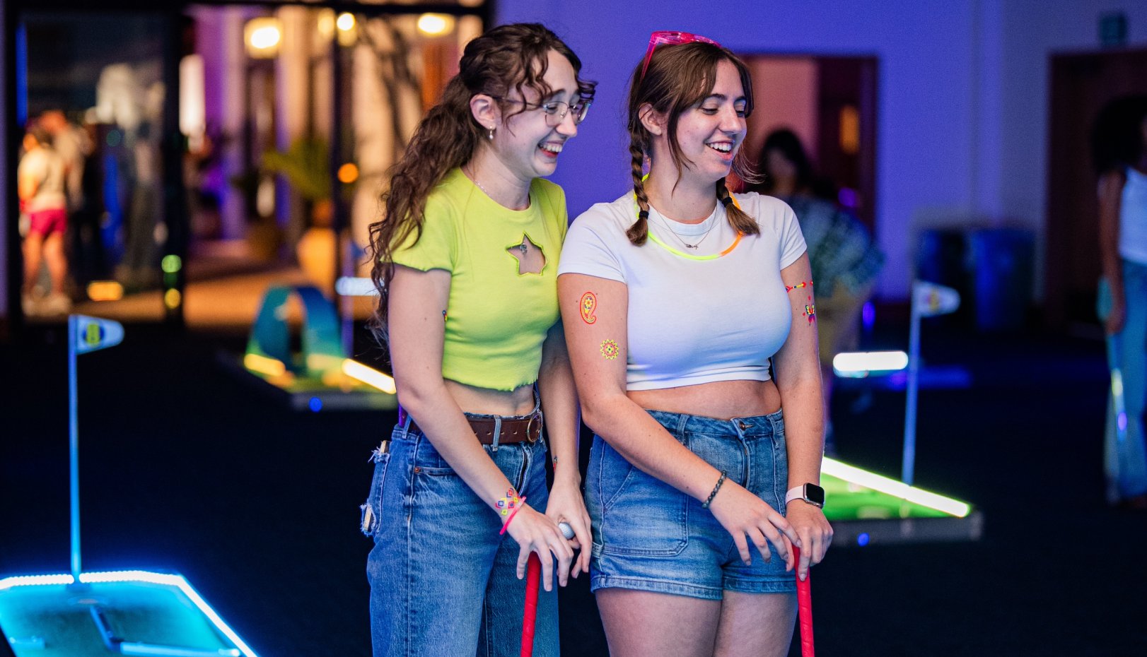 Aubrey Bonham '28 and  Amber Spinetta '28 enjoying glow golf at Glow SMC