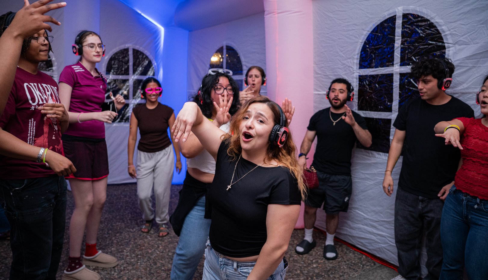 Students enjoying silent disco Second Annual Glow SMC