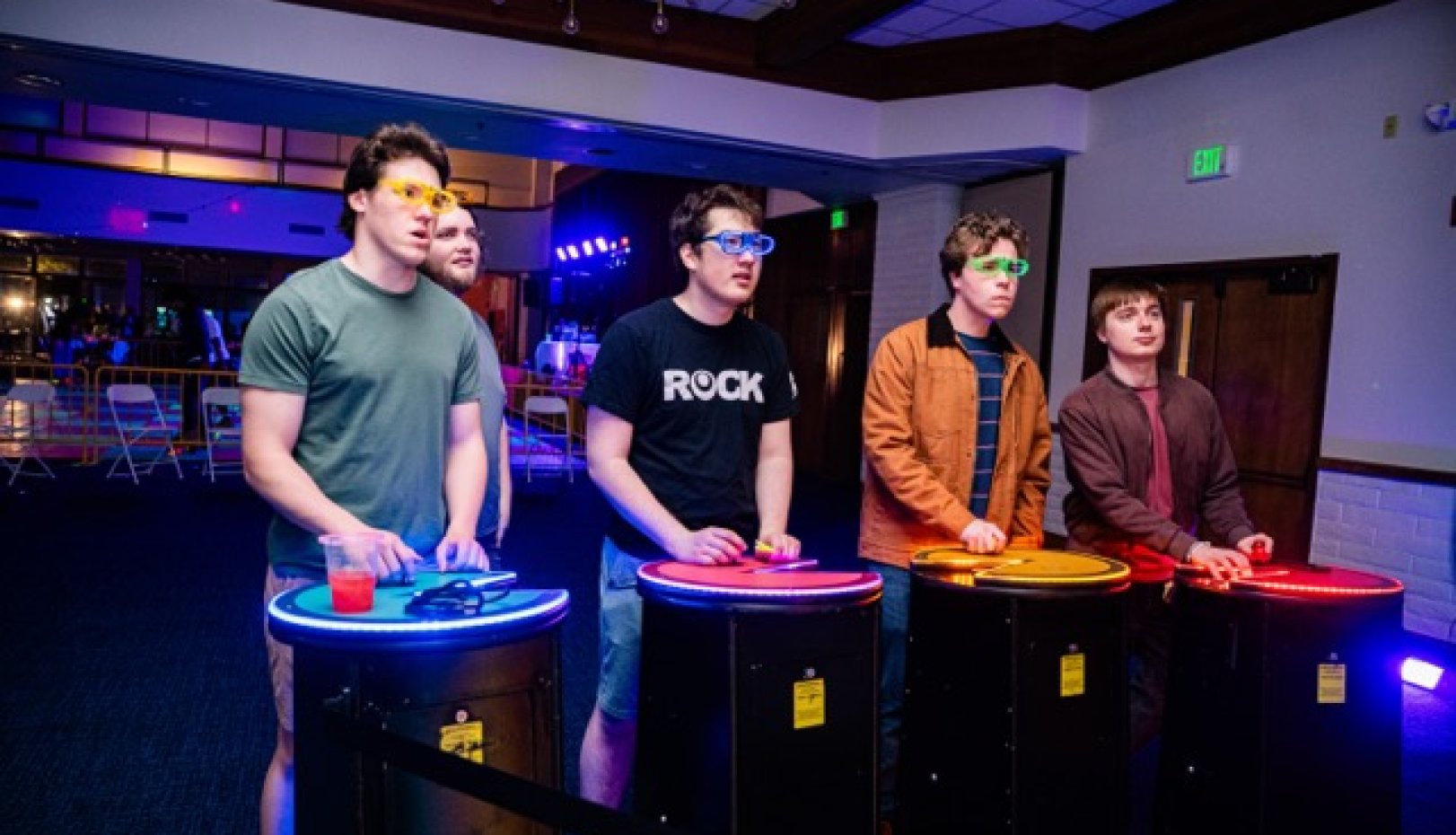 Students playing arcade game at Glow SMC