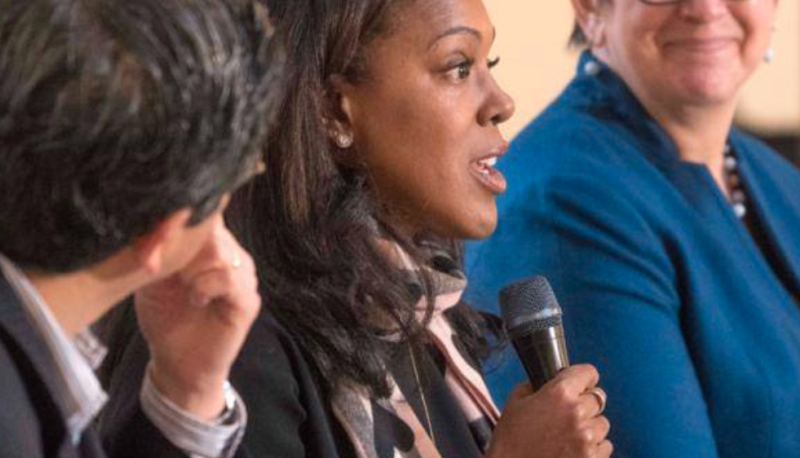 two women and a man at speaker series