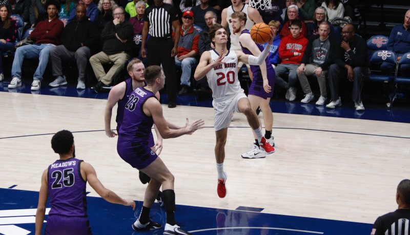 Aidan Mahaney goes for a layup against Portland