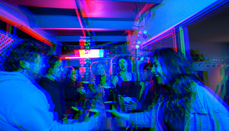 Seniors from "Willow &amp; Houston..." theatre production cheers using red Solo cups at a party.