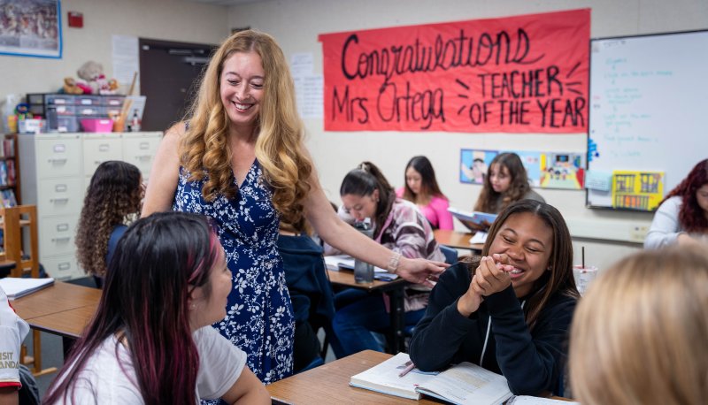 Annalouisa Gonzalez-Ortega smiles while talking with students in her classroom