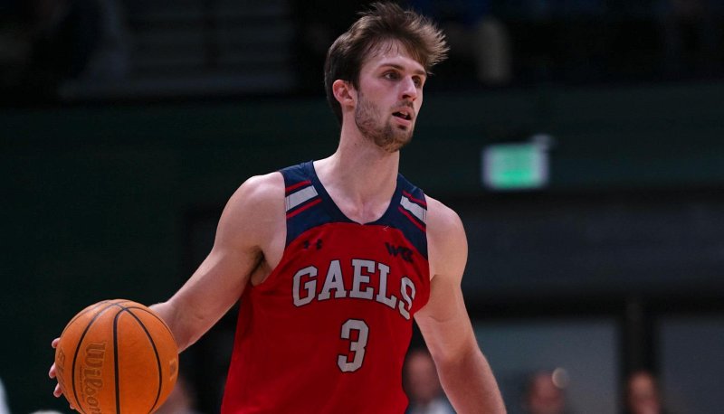 Men's Basketball Player Augustus Marciulionis drives against USF in January 2024