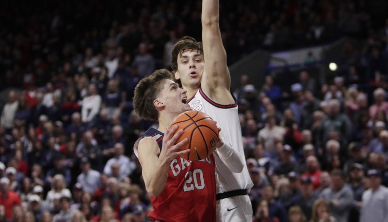 Men's basketball player Aidan Mahaney drives against Gonzaga in February 2024