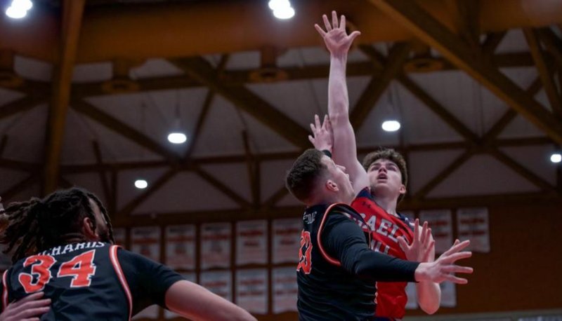 Men's basketball player Alex Ducas shoots against Pacific in February 2024