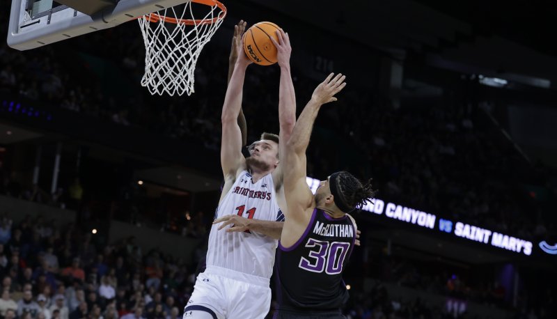 Men's basketball player Mitchell Saxen shoots against Grand Canyon in NCAA Tournament March 2024
